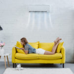 Woman reading a book on couch